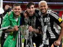 Newcastle United's Bruno Guimaraes, Sandro Tonali and Joelinton celebrate with the EFL Cup on March 16, 2025